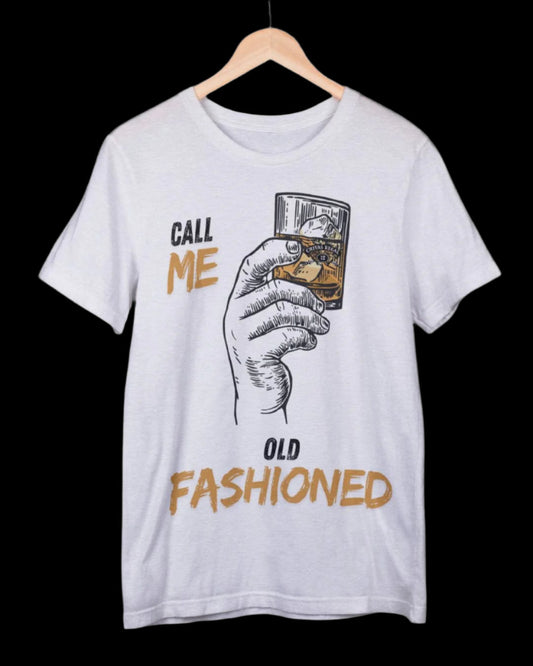 White t-shirt with graphic of a hand holding a glass and text 'Call Me Old Fashioned' on a hanger.